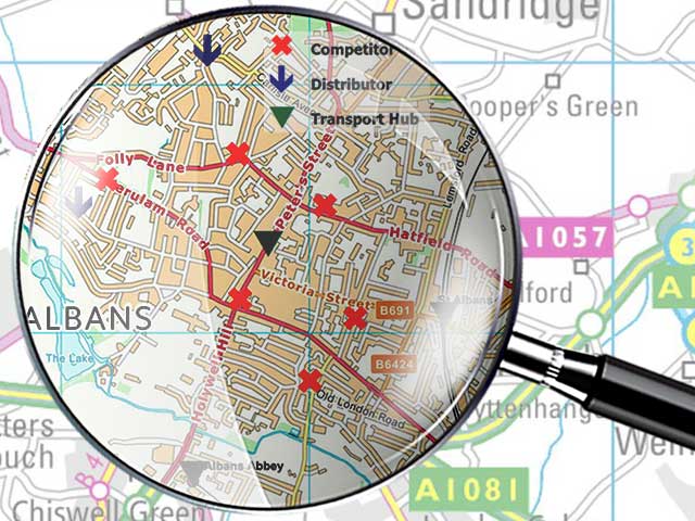A magnifier focused on a location analysis map.